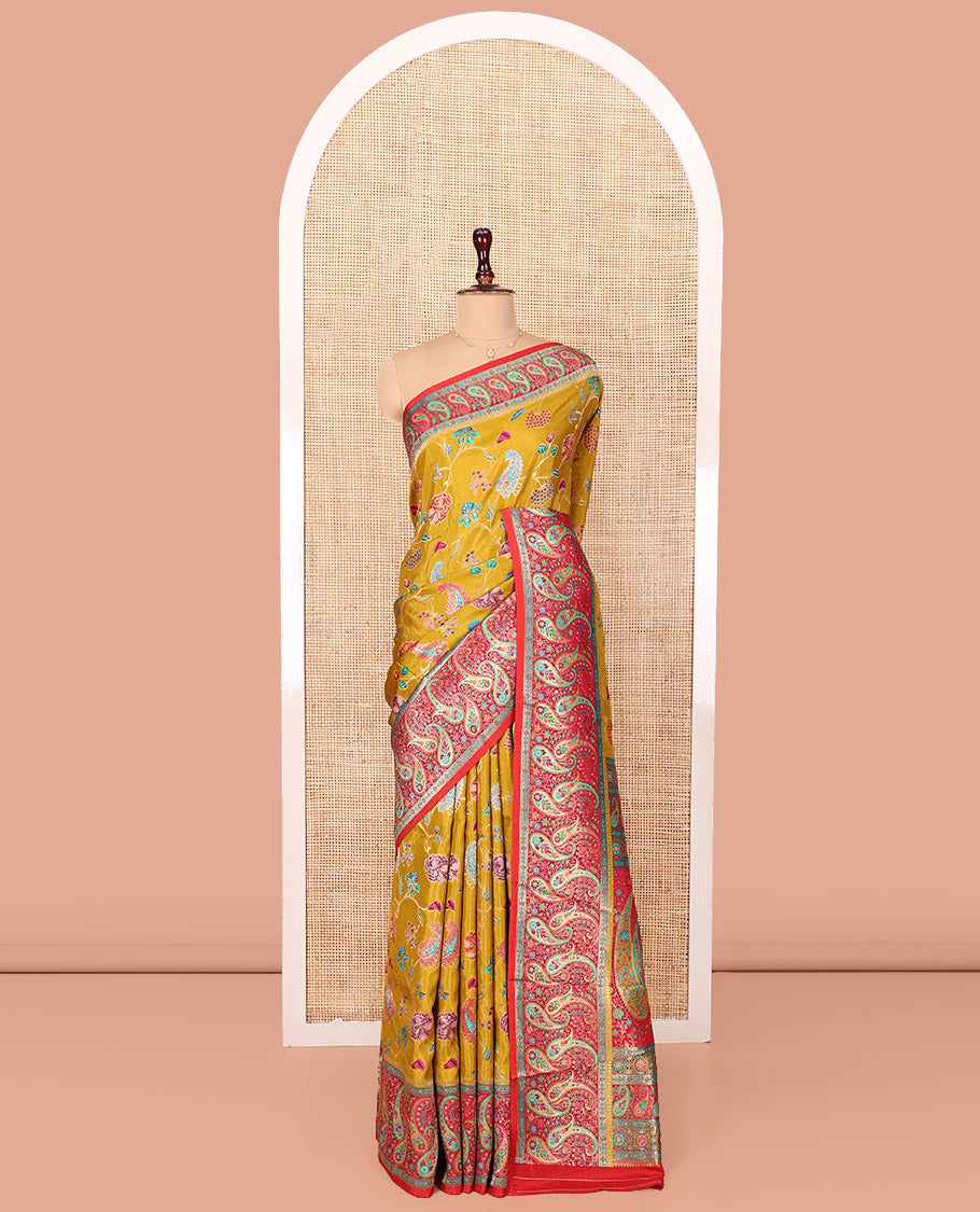 Mustard Dola Silk Saree, Elegantly Printed with Colorful Floral-Paisley Vine Design on Its Body, Complemented by Contrast Paisley Design Border, Pallu of Paisleys, and Paired with a Contrast Blouse