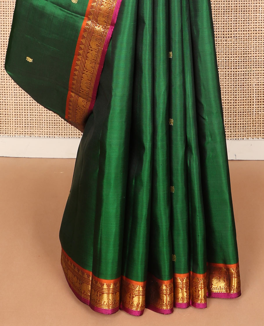 Green mayil buttas silk saree, contrast border of thazampoo rekku,banaras,muthu,mayil & yaanai & pallu of rudraksham designs