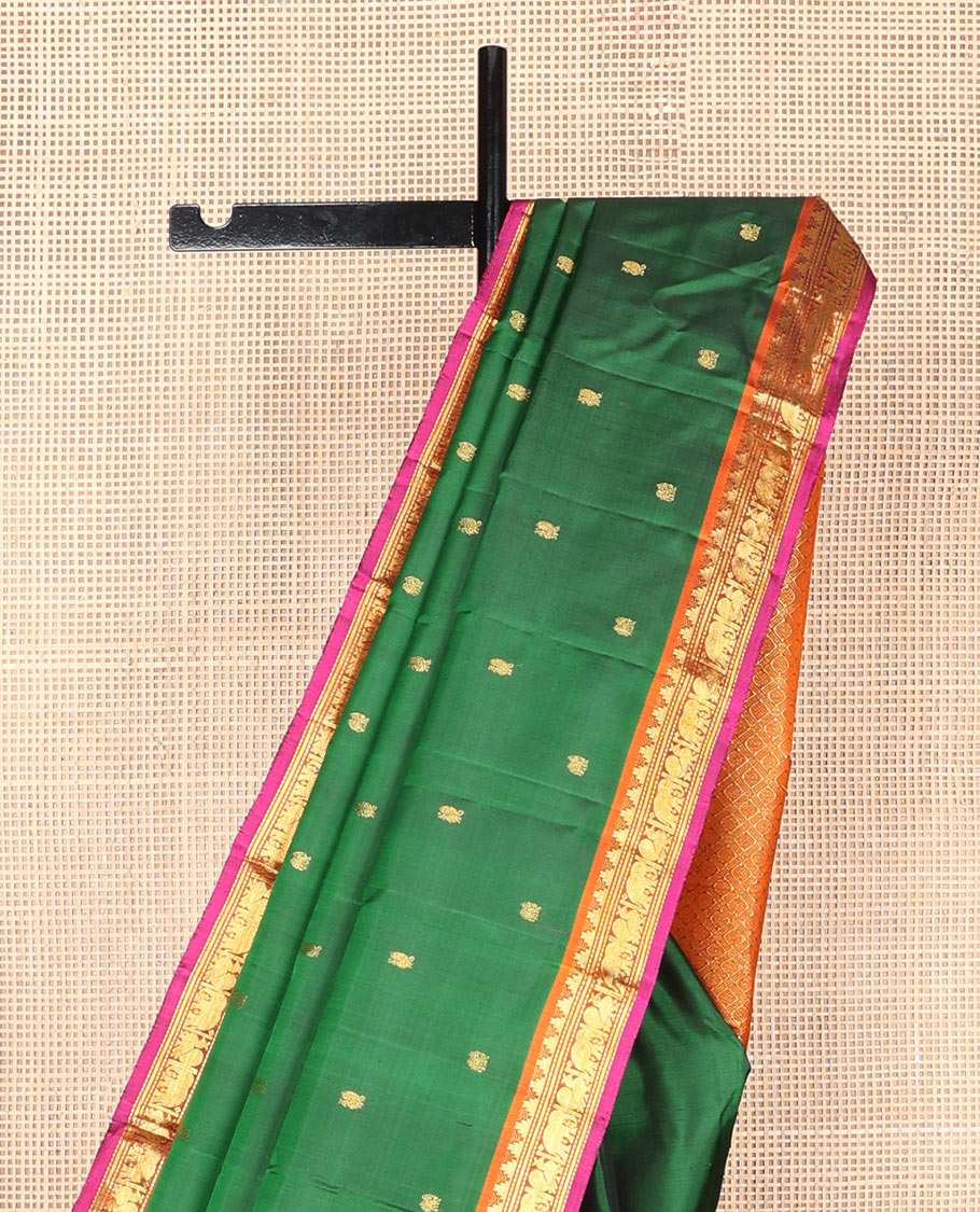Green mayil buttas silk saree, contrast border of thazampoo rekku,banaras,muthu,mayil & yaanai & pallu of rudraksham designs