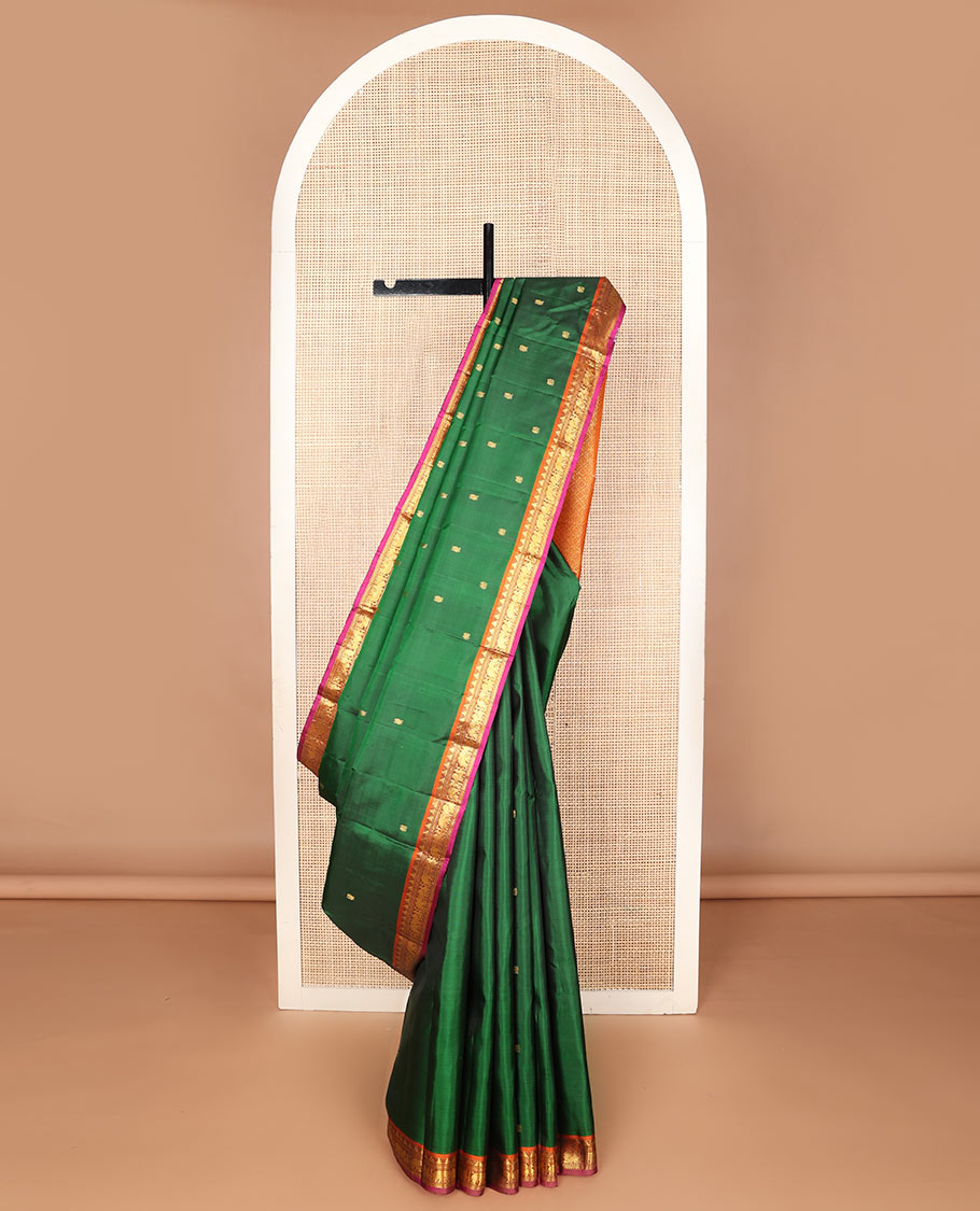 Green mayil buttas silk saree, contrast border of thazampoo rekku,banaras,muthu,mayil & yaanai & pallu of rudraksham designs