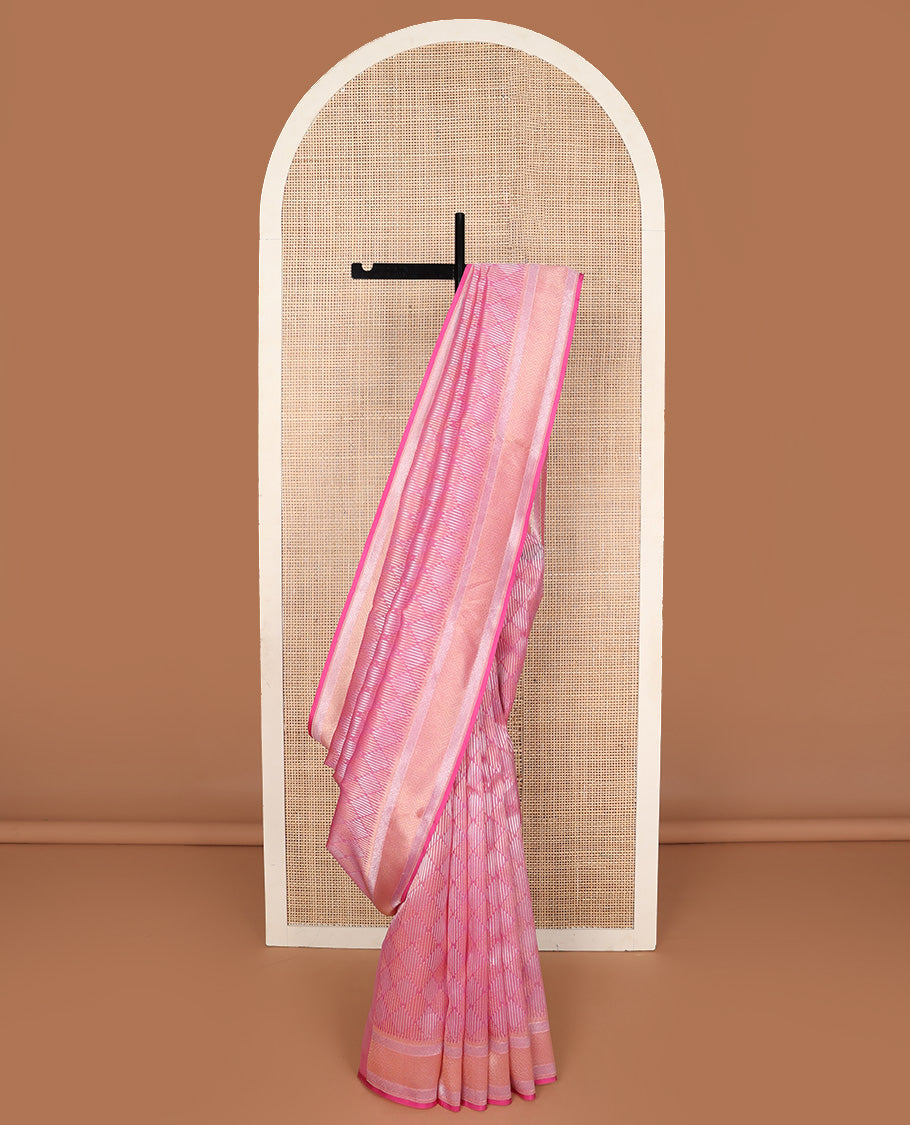 Pink jaal jacquard silk saree, geometric patterned border, and pallu of chevron design