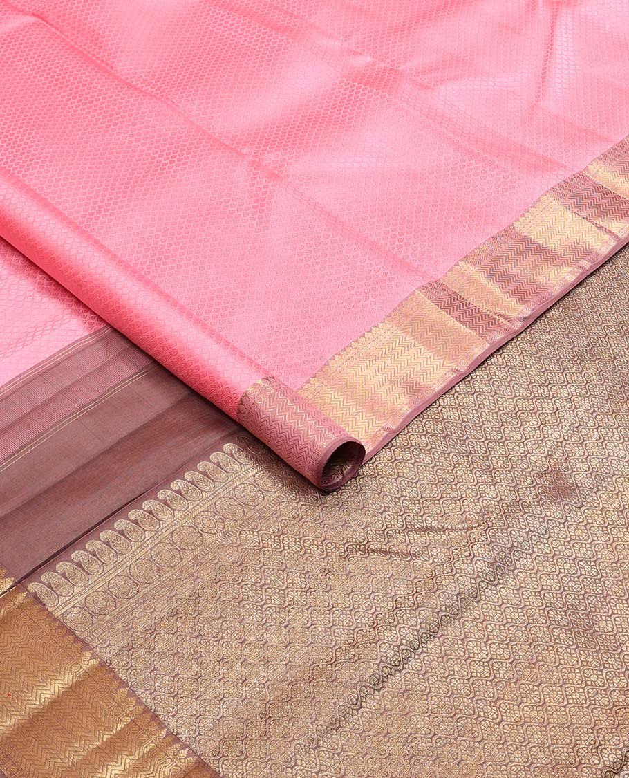 Light pink floral design silk saree with contrast border of thilakam mokku, paun, vanki design & floral pallu