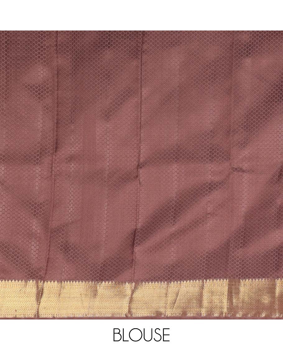 Light pink floral design silk saree with contrast border of thilakam mokku, paun, vanki design & floral pallu