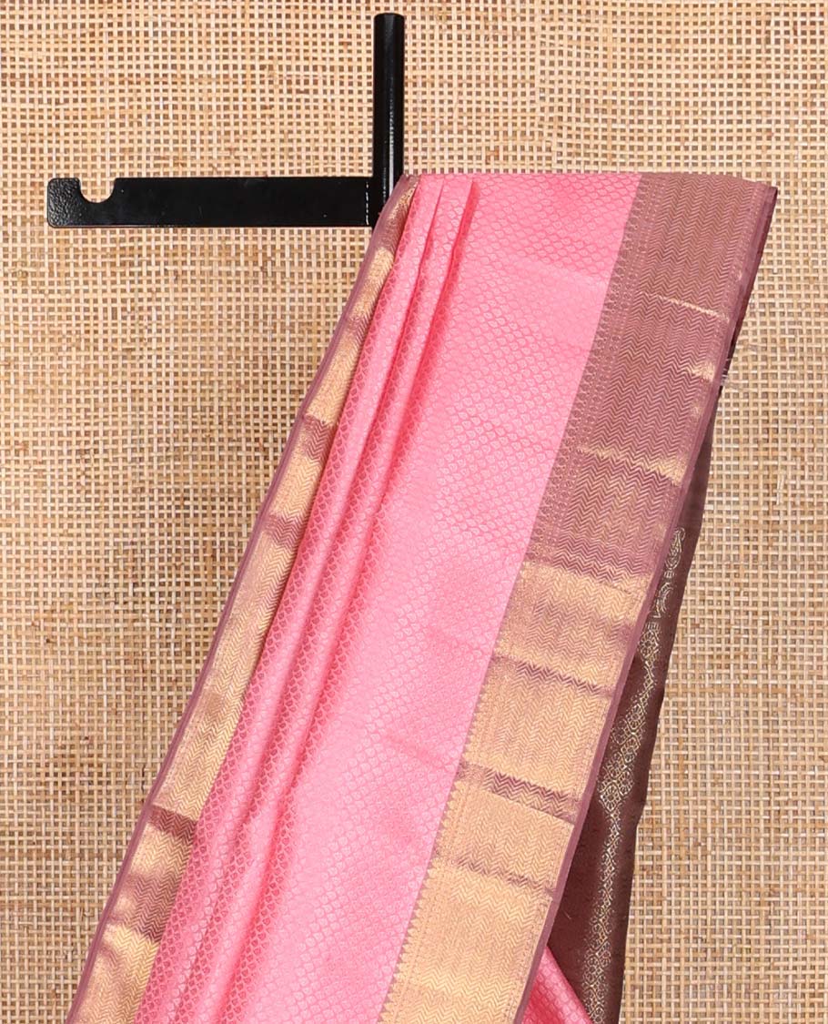 Light pink floral design silk saree with contrast border of thilakam mokku, paun, vanki design & floral pallu