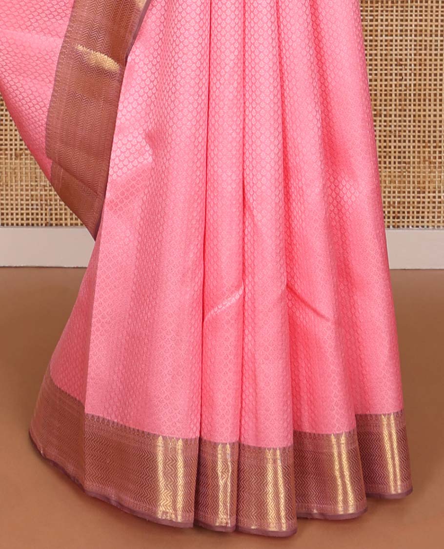 Light pink floral design silk saree with contrast border of thilakam mokku, paun, vanki design & floral pallu