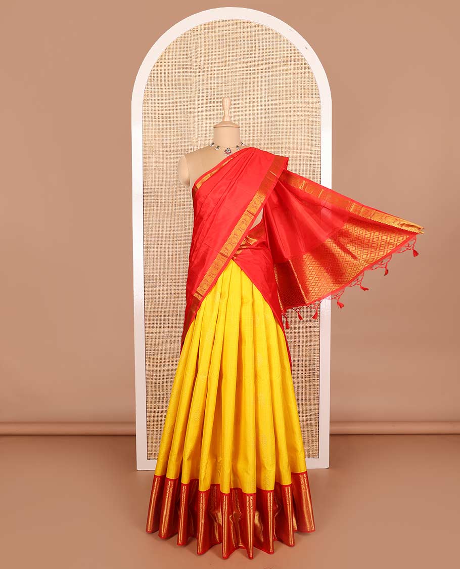 Yellow pure silk half-saree, zari design skirt, contrast korvai border of mayil, rudraksham, and mayil kann designs, and zari bordered blouse, and contrast jaal dhavani
