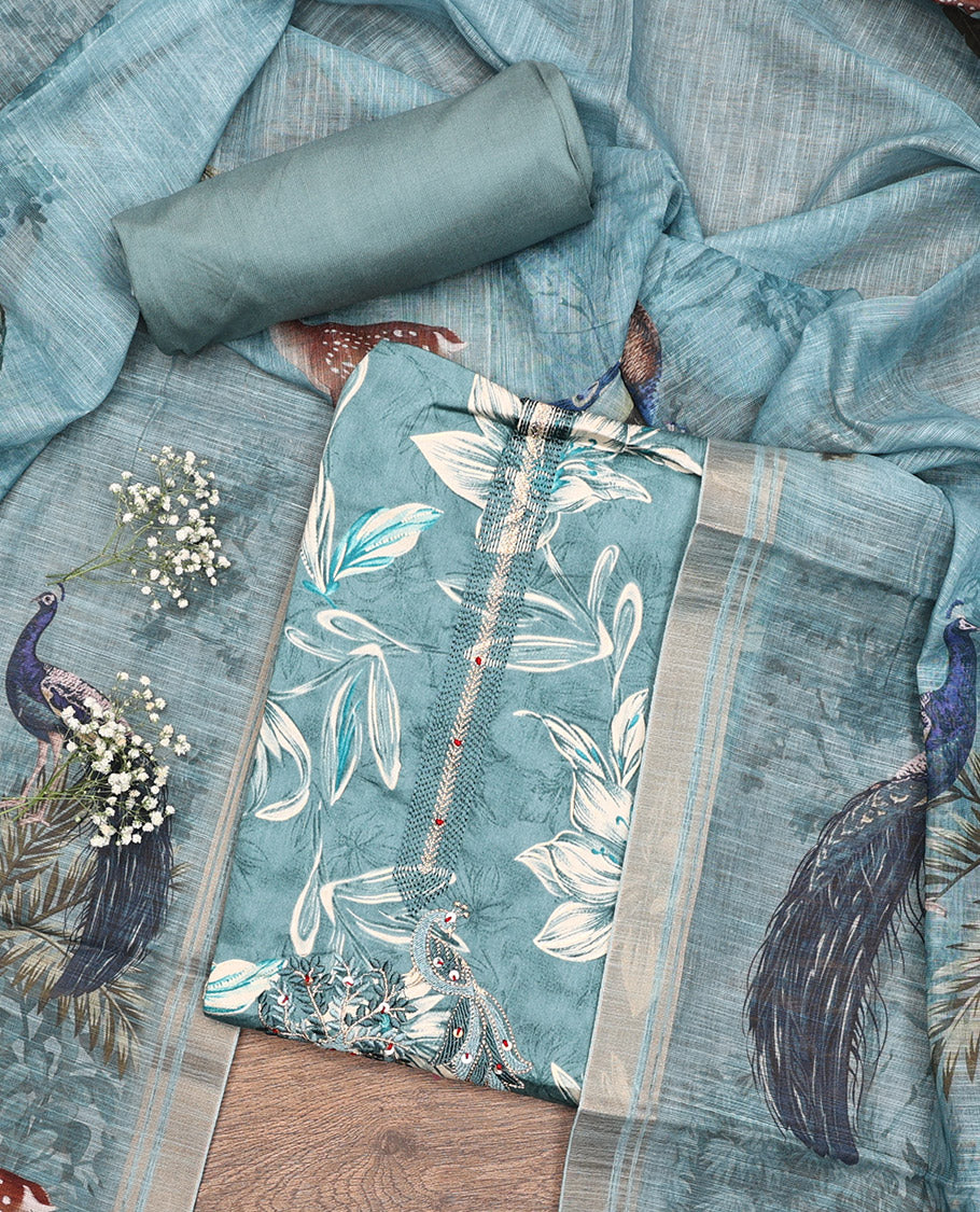 Blue Material Chudidar Set, Adorned with Floral Print, and Embroidery on Its Muslin Top, a Plain Cotton Bottom, and Paired with a Peacock Printed Lilan Cotton Dupatta