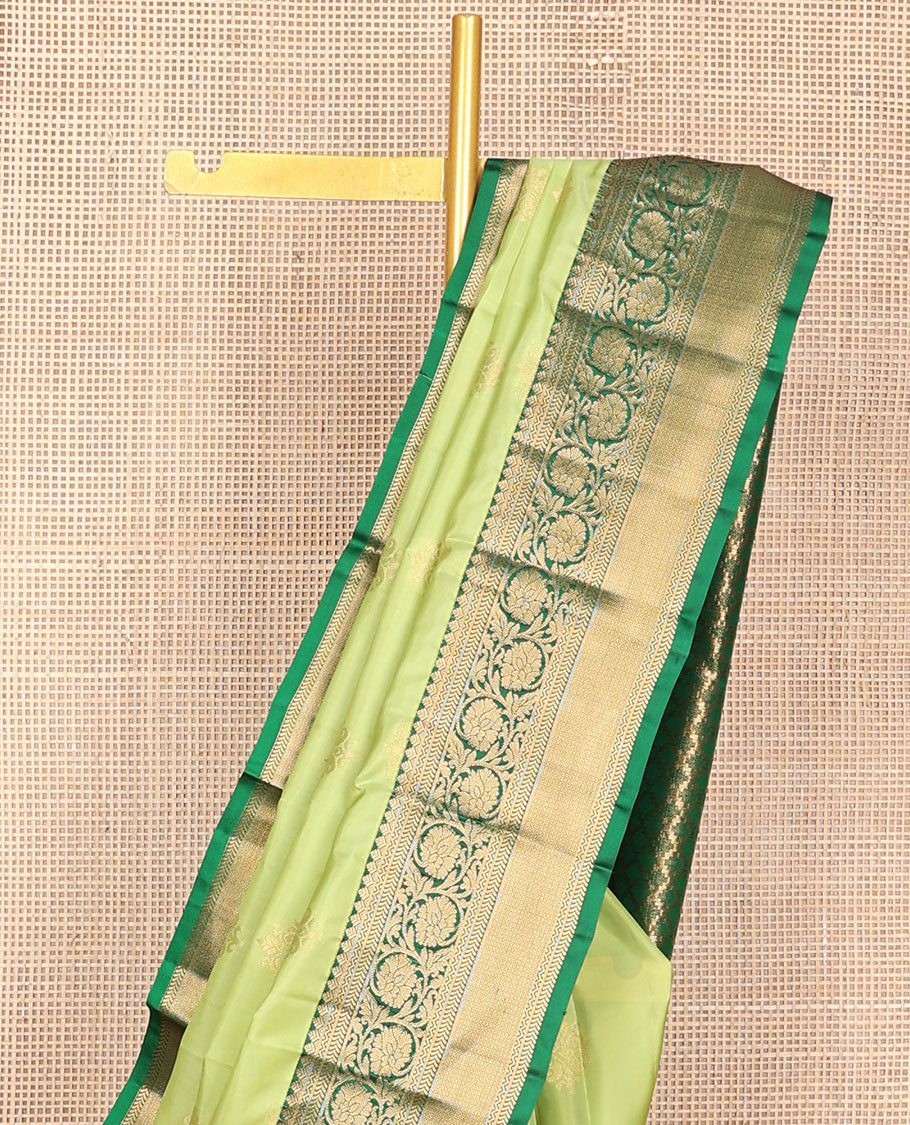 Green zari buttas vasundhara silk mix saree, contrast border of neli,kathir,kodi visiry & mayil kann & pallu of geometric patterns