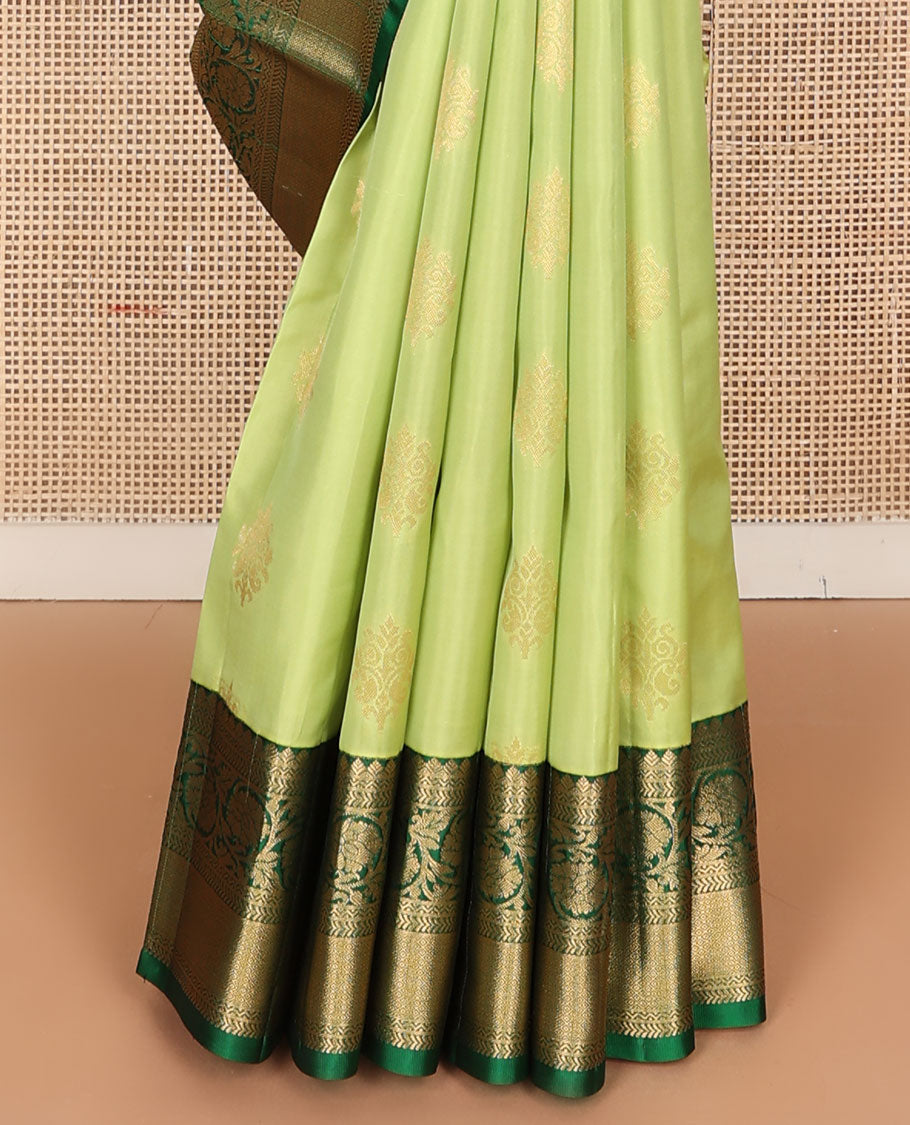 Green zari buttas vasundhara silk mix saree, contrast border of neli,kathir,kodi visiry & mayil kann & pallu of geometric patterns