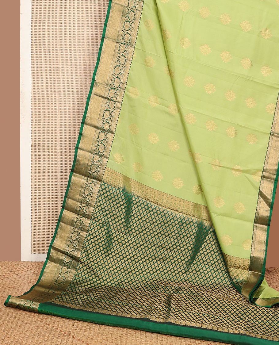 Green zari buttas vasundhara silk mix saree, contrast border of neli,kathir,kodi visiry & mayil kann & pallu of geometric patterns