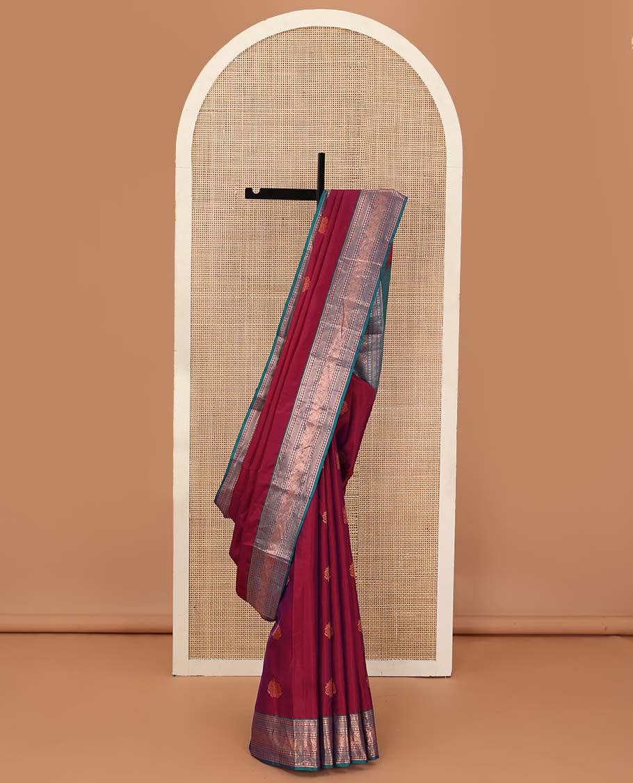 Red zari buttas Vasundhara silk mix saree, contrast border of thilakam mokku, banaras, poun, neli, and mayil design, and zari-rich jaal pallu