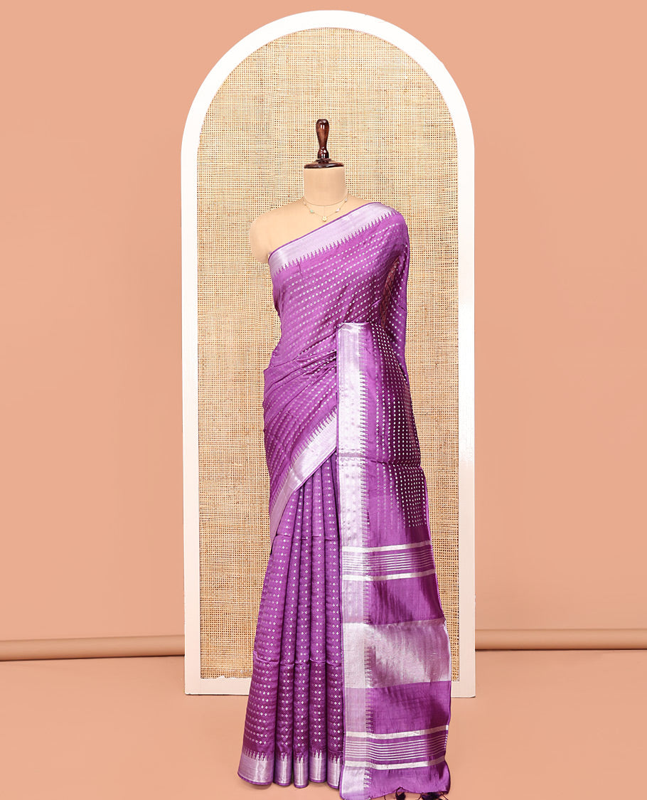 Purple Banana Pith Saree, Elevated with Buttas All Over Its Body, Highlighted by Temple Zari Border, Pallu of Gleaming Zari Stripes, and Paired with a Matching Blouse
