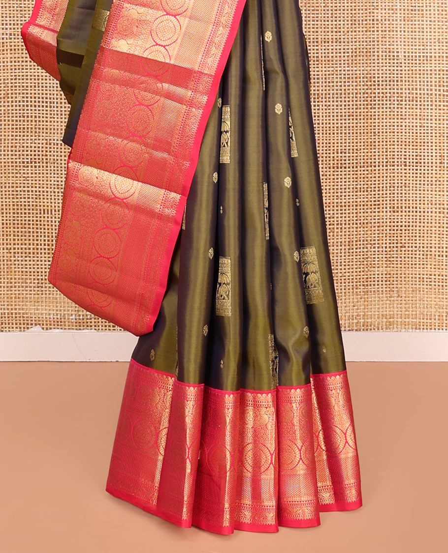 Green Vasundhara Silk Saree, Elevated with Zari Buttas on Its Body, Complemented by a Contrast Border of Thilakam Mokku, Muthu, Ara Maadam, Paisa, Kodi Visiry, and Annam Chakram Designs, Grandly Zari-Woven Pallu, and Paired with a Contrast Blouse