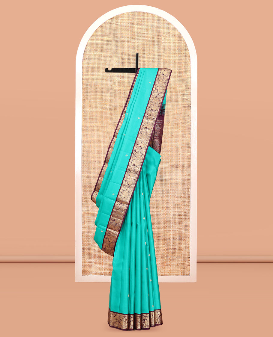 Blue Vasundhara Silk Saree, Adorned with Zari Buttas, a Contrast Korvai Border of Thilakam, Banaras, and Mayil Designs, Richly Woven Pallu, and a Contrast Blouse
