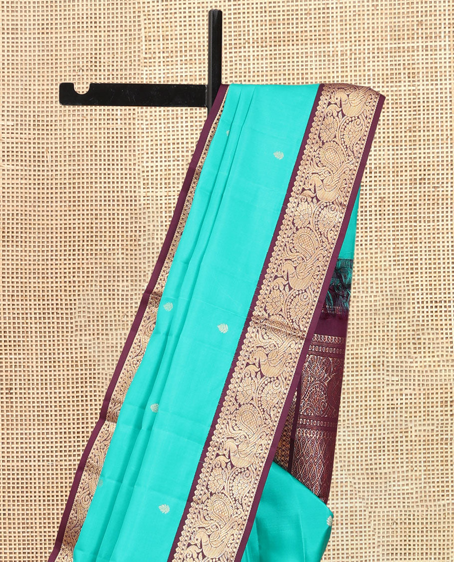 Blue Vasundhara Silk Saree, Adorned with Zari Buttas, a Contrast Korvai Border of Thilakam, Banaras, and Mayil Designs, Richly Woven Pallu, and a Contrast Blouse
