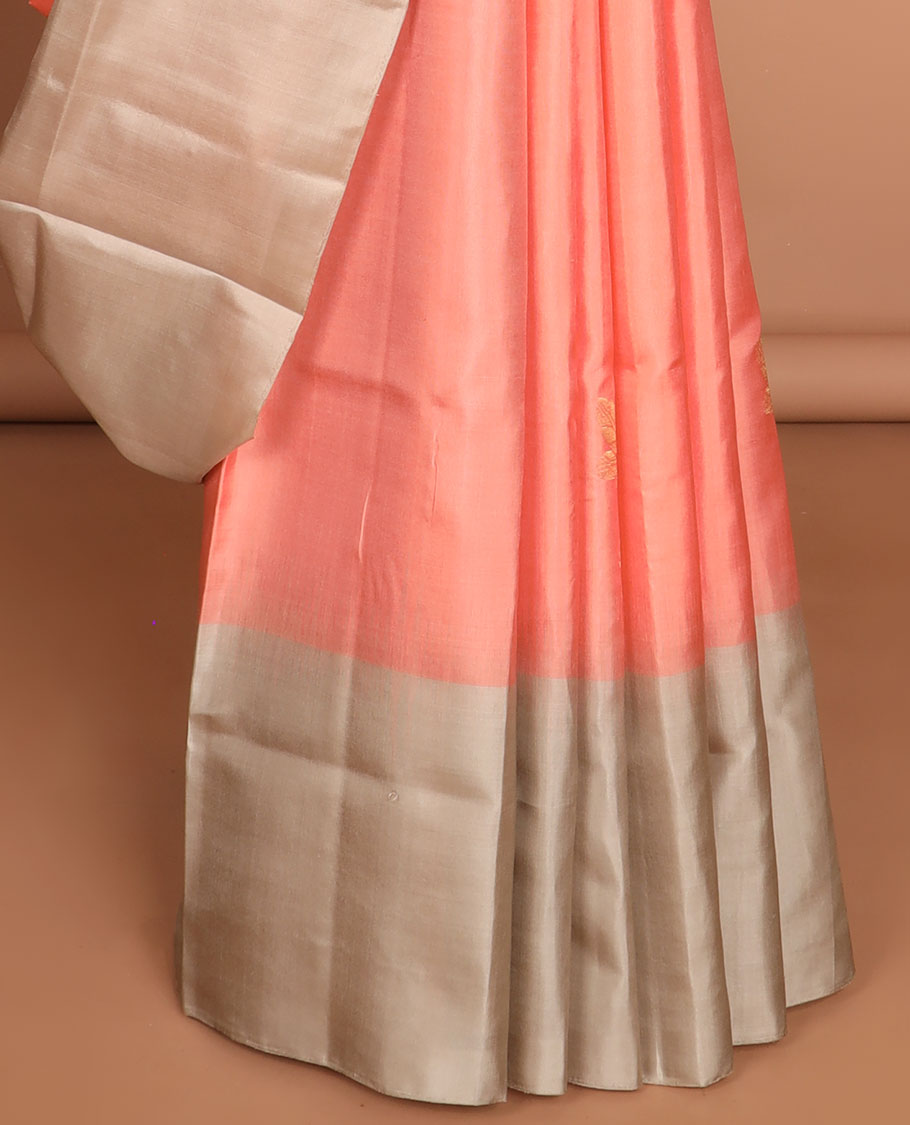 Peach floral buttas soft silk saree with contrast floral border & round buttas pallu