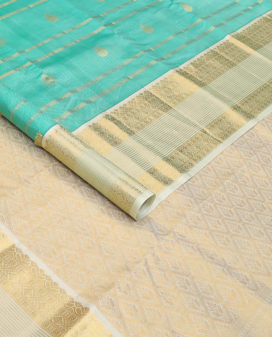 Turquoise blue zari design silk saree, contrast traditional motifs steeped zari border, and zari-rich jaal pallu