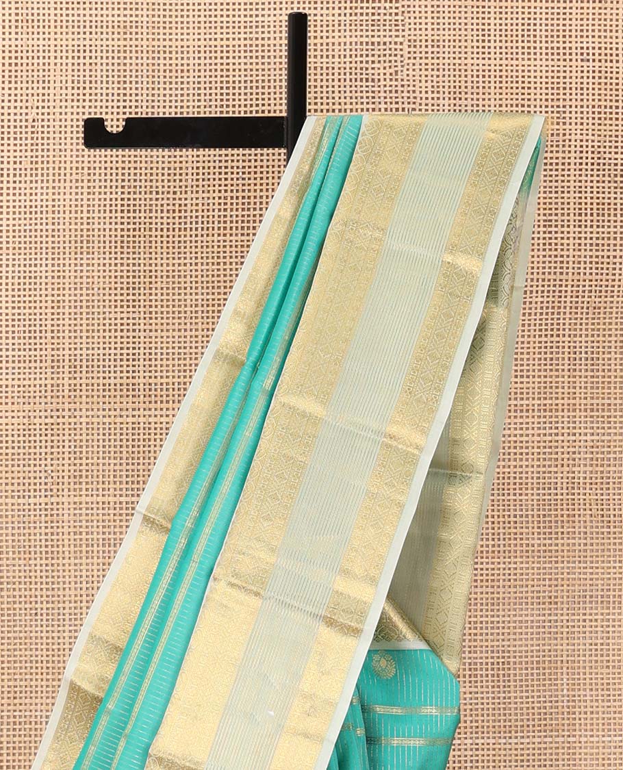 Turquoise blue zari design silk saree, contrast traditional motifs steeped zari border, and zari-rich jaal pallu