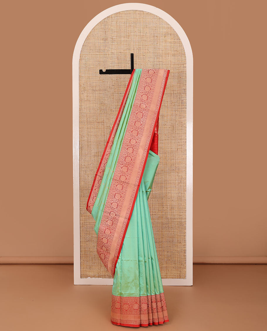 Green zari buttas katan silk saree, contrast traditional border of floral creeper design, and floral jaal pallu