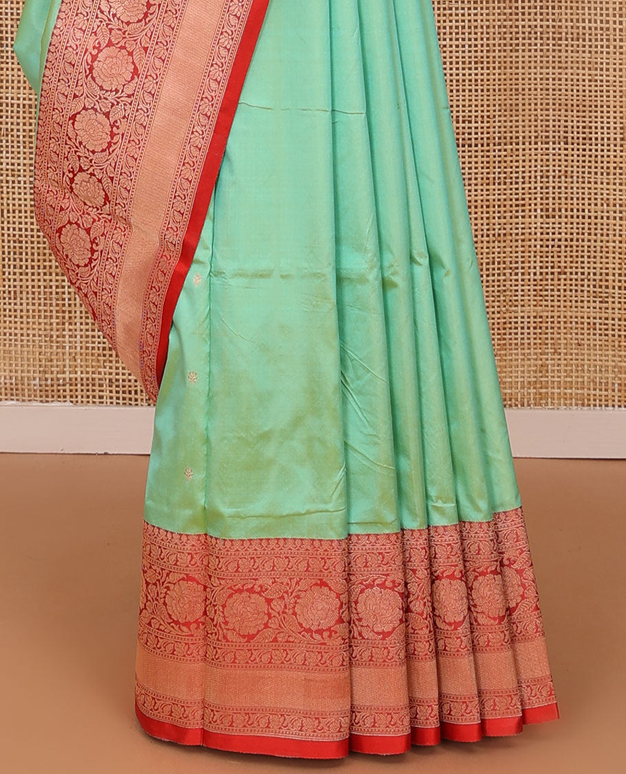 Green zari buttas katan silk saree, contrast traditional border of floral creeper design, and floral jaal pallu