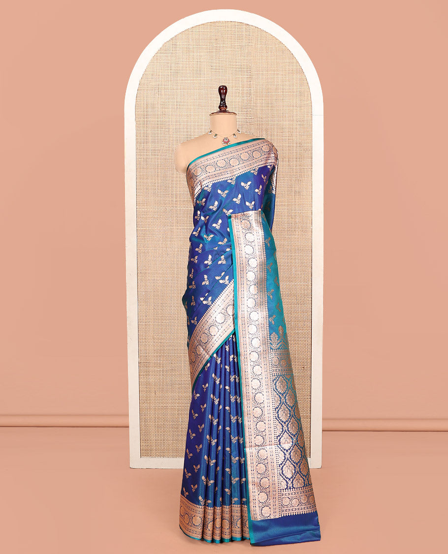 Blue Banarasi Nylon Saree, Bedecked with Floral Buttas, Highlighted by a Traditional Zari Border, Intricate Pallu, and a Matching Blouse