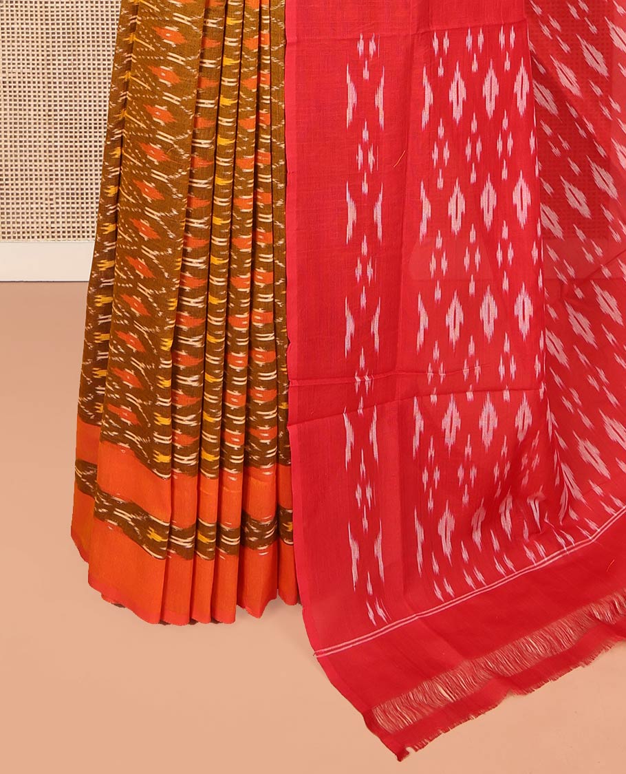 Brown Ikkat Cotton Saree, Ornamented with Ikkat-Style Ogee Patterns on Its Body, Complemented by a Contrast Ikkat Border, Pallu of Ikkat-Style Buttas, and Has No Blouse