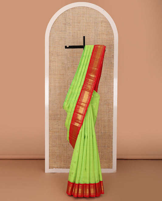 Green zari buttas Kanchipuram silk saree, contrast one-sided korvai border of panner sombu,banaras,muthu & mayil kann &  zari design pallu