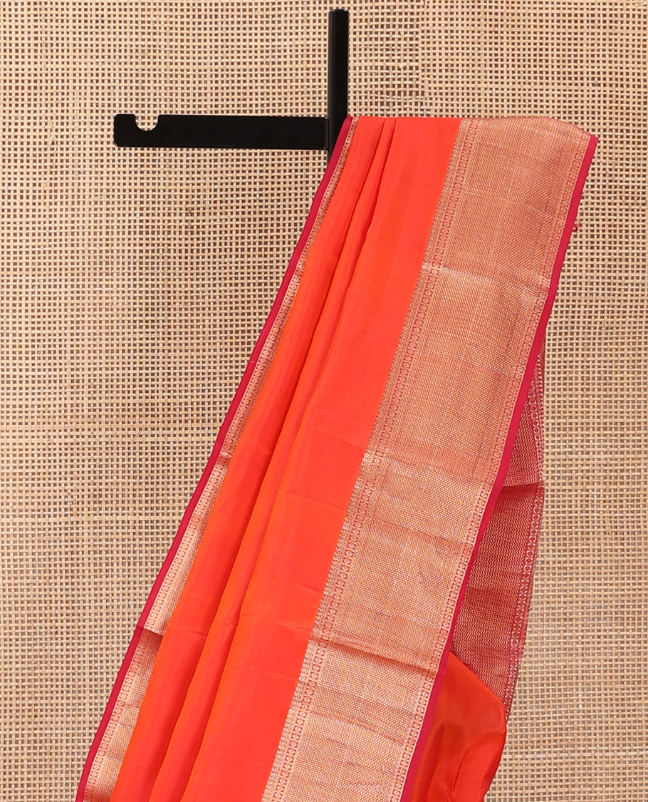Orange plain Kanchipuram silk saree, contrast border of thilakam, banaras, kuyil kann, and rudraksham designs, and jaal pallu