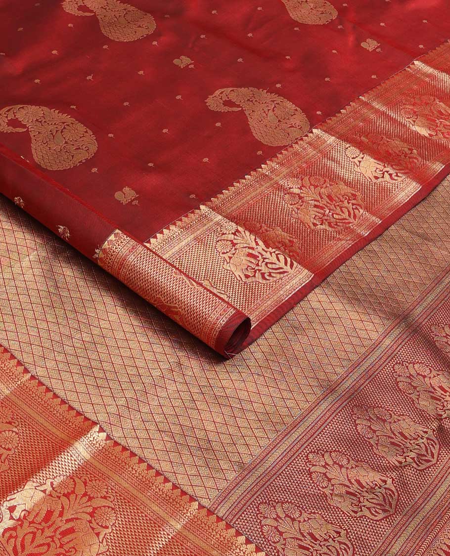 Maroon zari buttas silk saree, zari border of thilakam mokku, muthu, kathir, ara maadam, and yaanai, and jaal pallu
