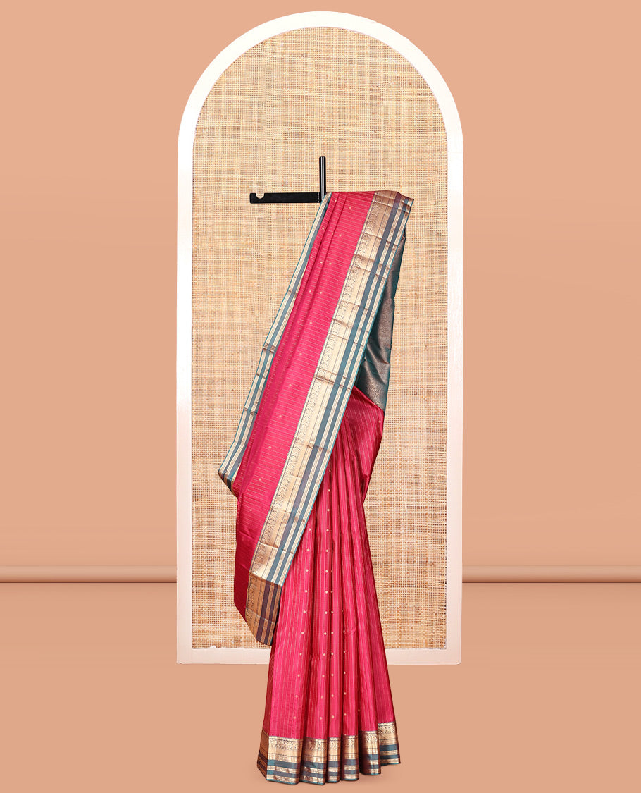 Red Vasundhara Silk Saree, Spotlighted with Zari Buttas and Stripes, a Contrast Rettai Pettu Border of Thilakam, Kamalam, Banaras, and Muthu Designs, Jaal Pallu, and Contrast Blouse