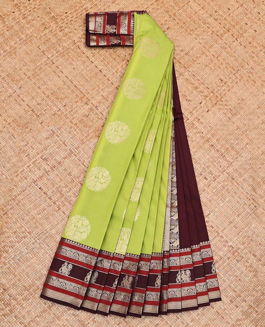 Green Budget Silk Saree, Detailed with Round Zari Buttas All Over Its Body, Complemented by Contrast Traditional Zari Designs Woven Border, Grand Jaal Pallu and Paired with a Contrast Blouse