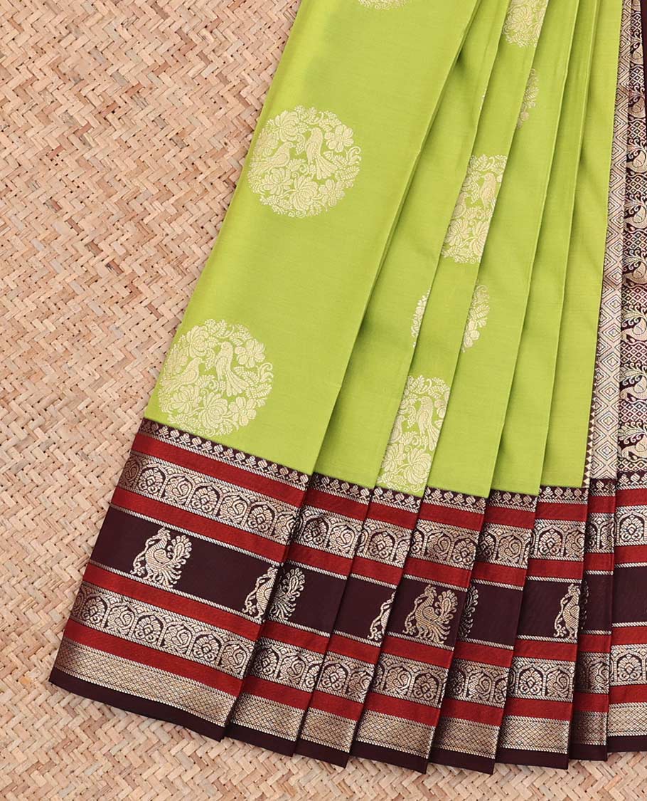 Green Budget Silk Saree, Detailed with Round Zari Buttas All Over Its Body, Complemented by Contrast Traditional Zari Designs Woven Border, Grand Jaal Pallu and Paired with a Contrast Blouse