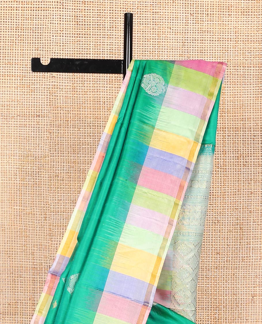 Green zari buttas soft silk saree, contrast multi-colored striped border, and jaal pallu