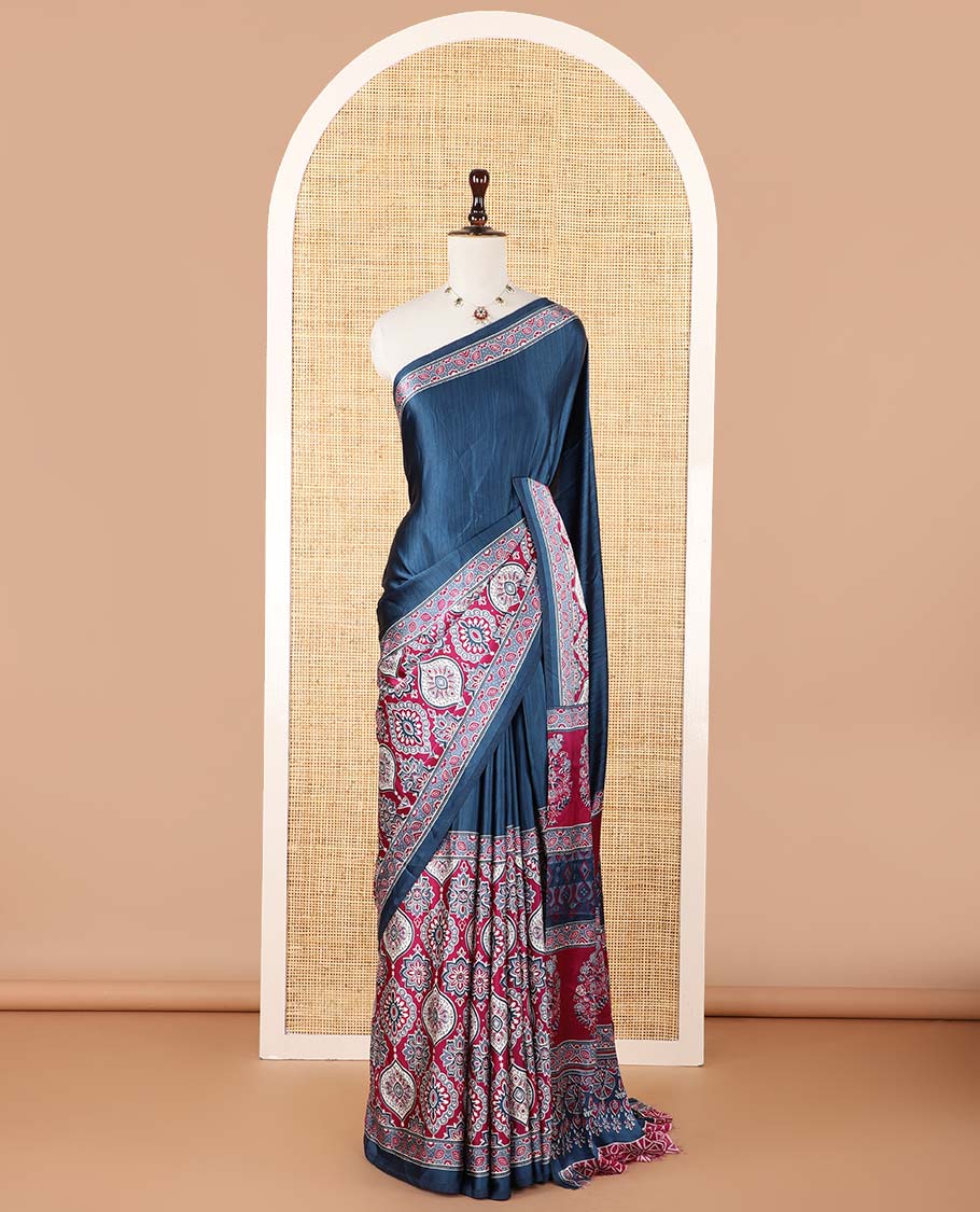 Blue half-&-half style modal satin saree features floral & geometric design ajrakh printed contrast border & pallu