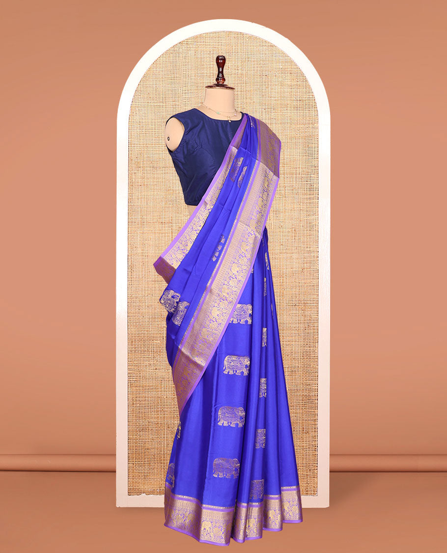 Blue Mysore Silk Saree, Mesmerized with Elephant Buttas Across Its Body, Complemented by Contrast Traditional Zari Border of Peacock-Elephant Designs, Intricately Designed Pallu, and Paired with a Contrast Blouse
