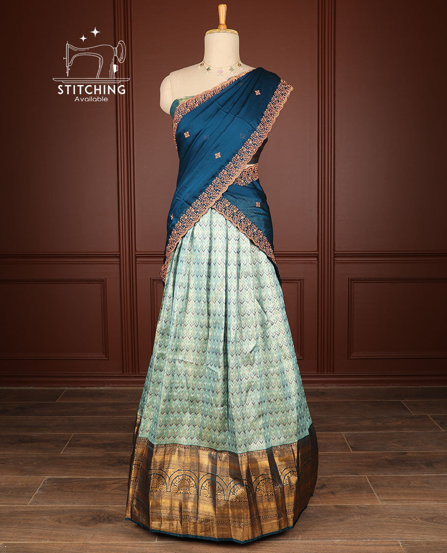 light blue geometric design half saree with contrast intricate zari design border, zari design blouse & floral embroidery dhavani