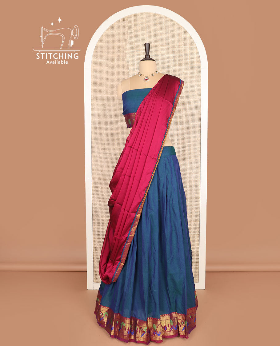 Blue cotton half-saree, plain with contrast paithani bordered skirt, matching blouse, and a contrast zari border dhavani