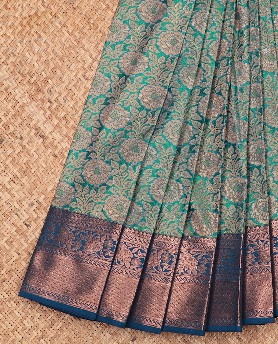 Blue floral jaal jacquard gift saree, contrast zari border, and ogee patterned pallu