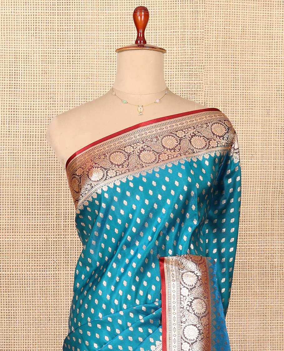 Blue Semi-Banaras Saree, Boldly Accentuated with Buttas on Its Body, Complemented by a Contrast Floral Creeper Design Border, Intricately Designed Pallu, and Paired with a Contrast Blouse