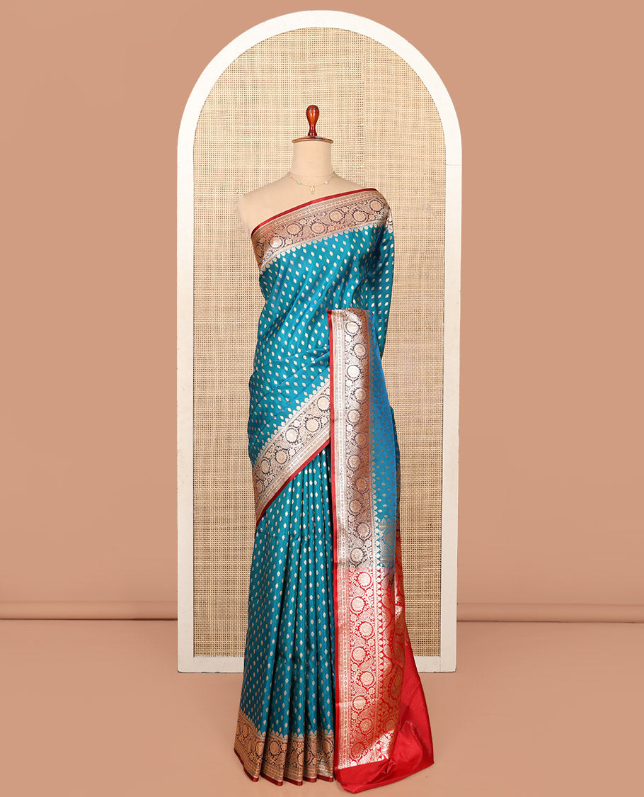 Blue Semi-Banaras Saree, Boldly Accentuated with Buttas on Its Body, Complemented by a Contrast Floral Creeper Design Border, Intricately Designed Pallu, and Paired with a Contrast Blouse