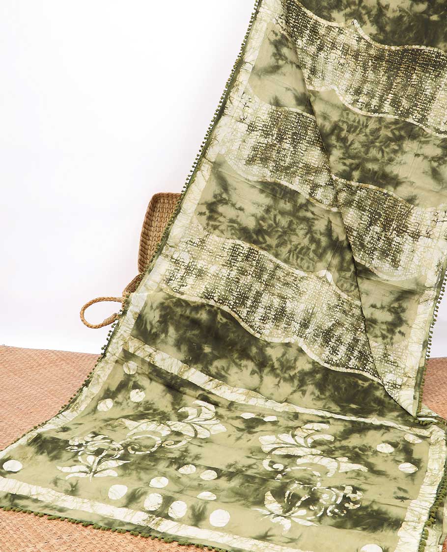 Green intricate batik style mul mul cotton saree with self-border & batik style leaf design pallu