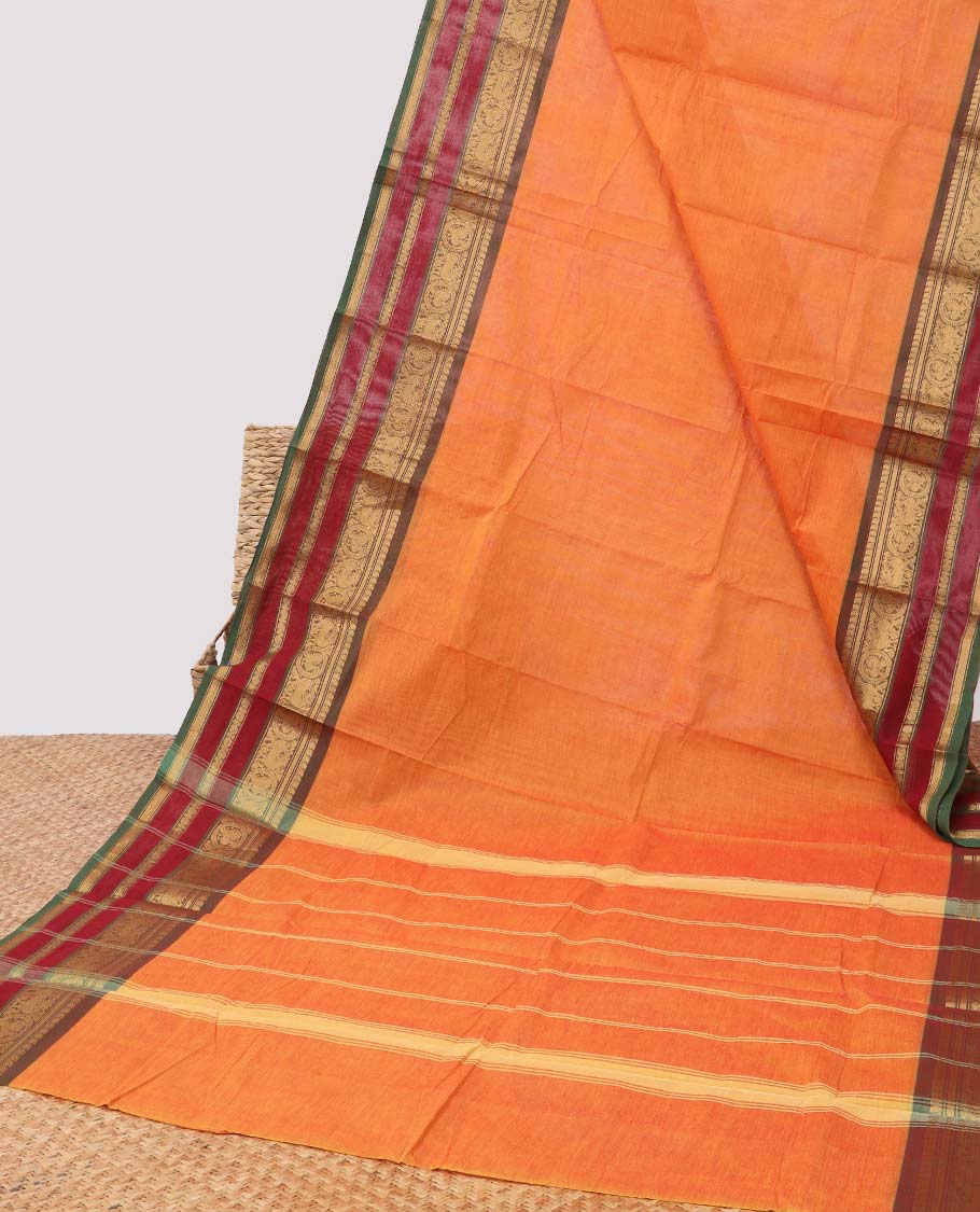 Light orange chettinad cotton saree with contrast traditional zari design border & striped pallu