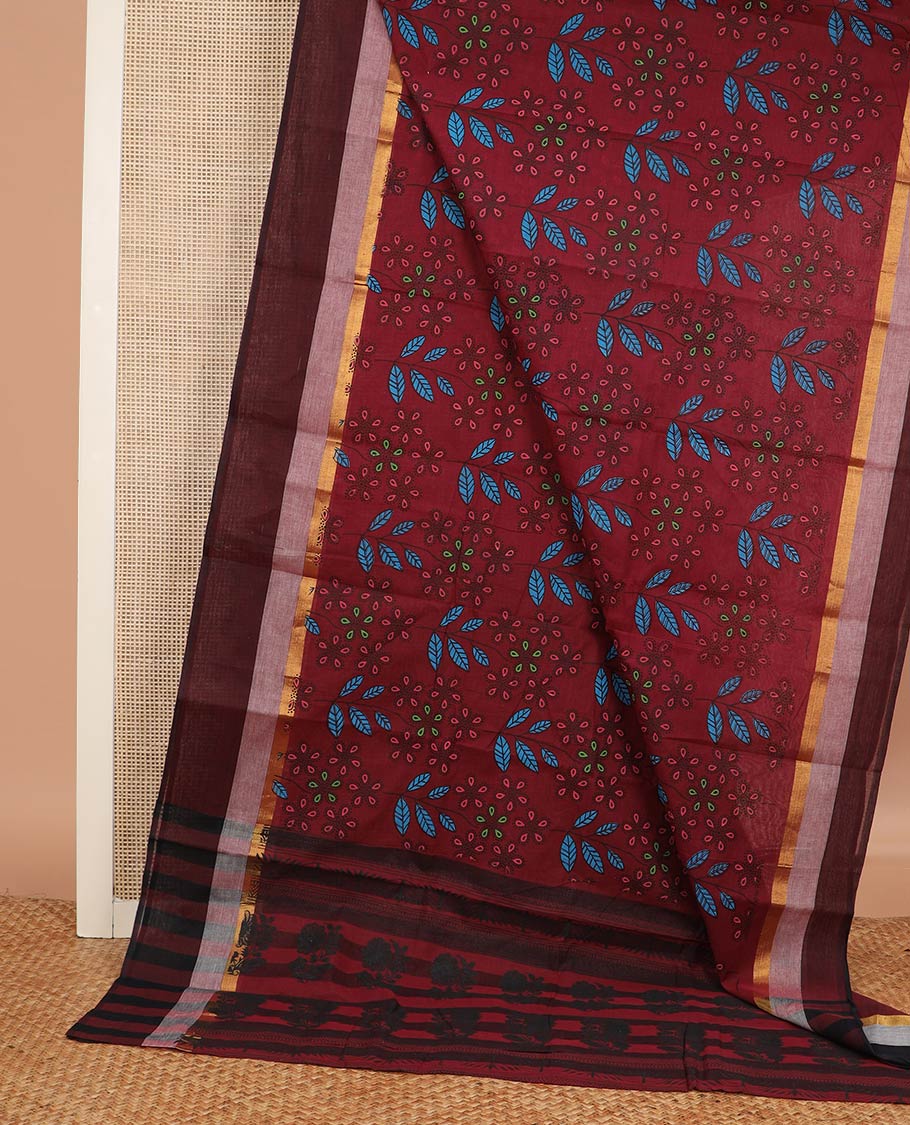 Maroon floral and leaf printed chirala cotton saree, contrast zari border, and pallu of floral print