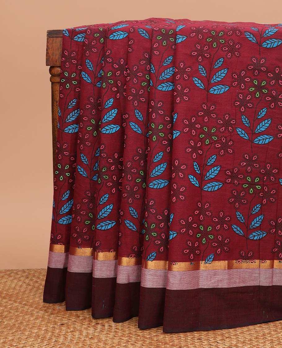 Maroon floral and leaf printed chirala cotton saree, contrast zari border, and pallu of floral print