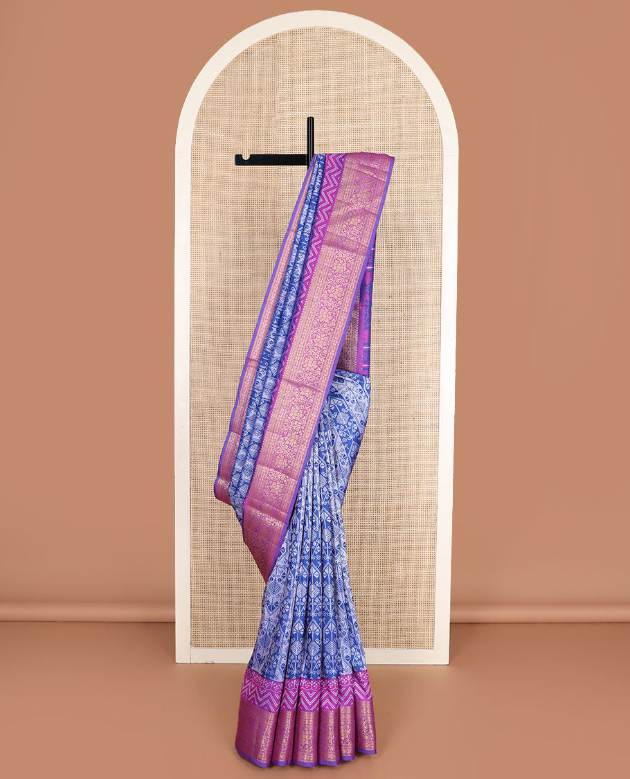 Blue intricately designed semi-banaras patola silk saree, contrast floral creeper zari design border, and pallu of chevron and floral designs