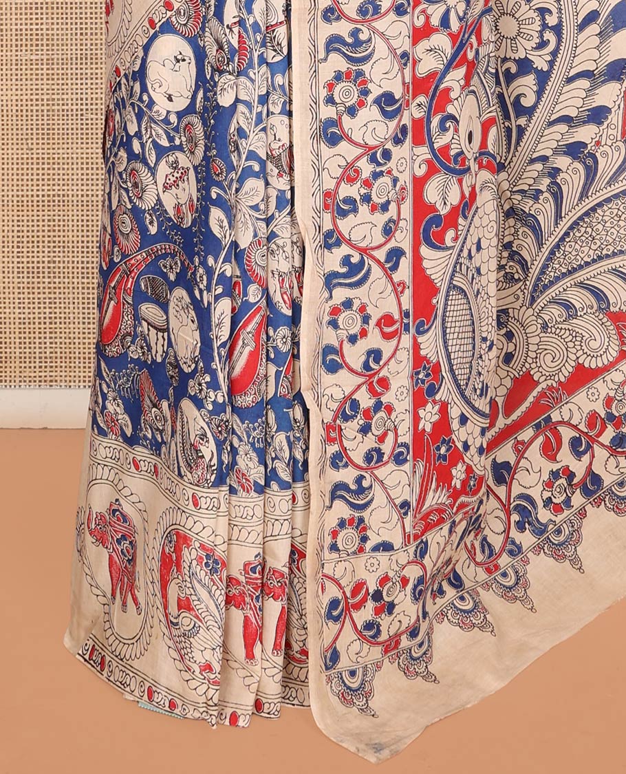 Blue Machine-Printed Kalamkari Cotton Saree, Detailed with Flora-Fauna Motifs, a Round Motifs Printed Border, Peacock Printed Pallu, and a Contrast Blouse