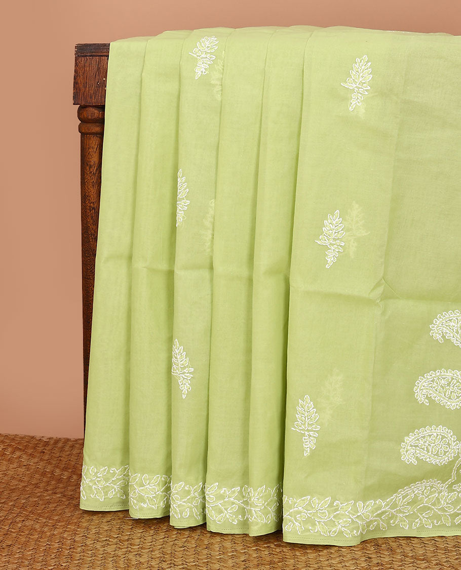 Green floral thread embroidered buttas Lucknowi chikankari saree, floral creeper thread embroidered border, and paisley embroidered pallu