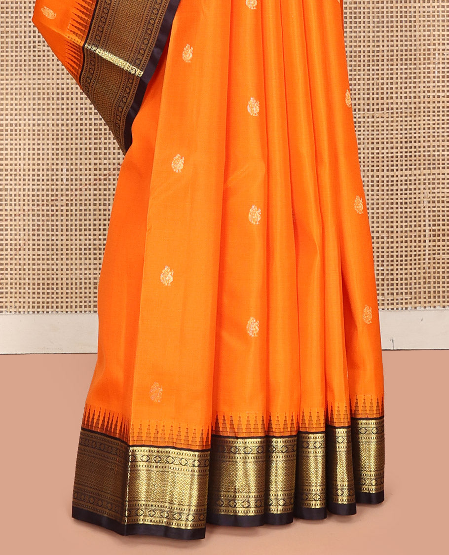 Orange Vasundhara Silk Saree, Artfully Woven with Mayil Buttas All Over Its Body, Complemented by Contrast Border Featuring Thazampoo Rekku, Muthu, Lavangam, and Mayil Kann Designs, a Grand Pallu of Jaal Designs, and Paired with a Contrast Blouse