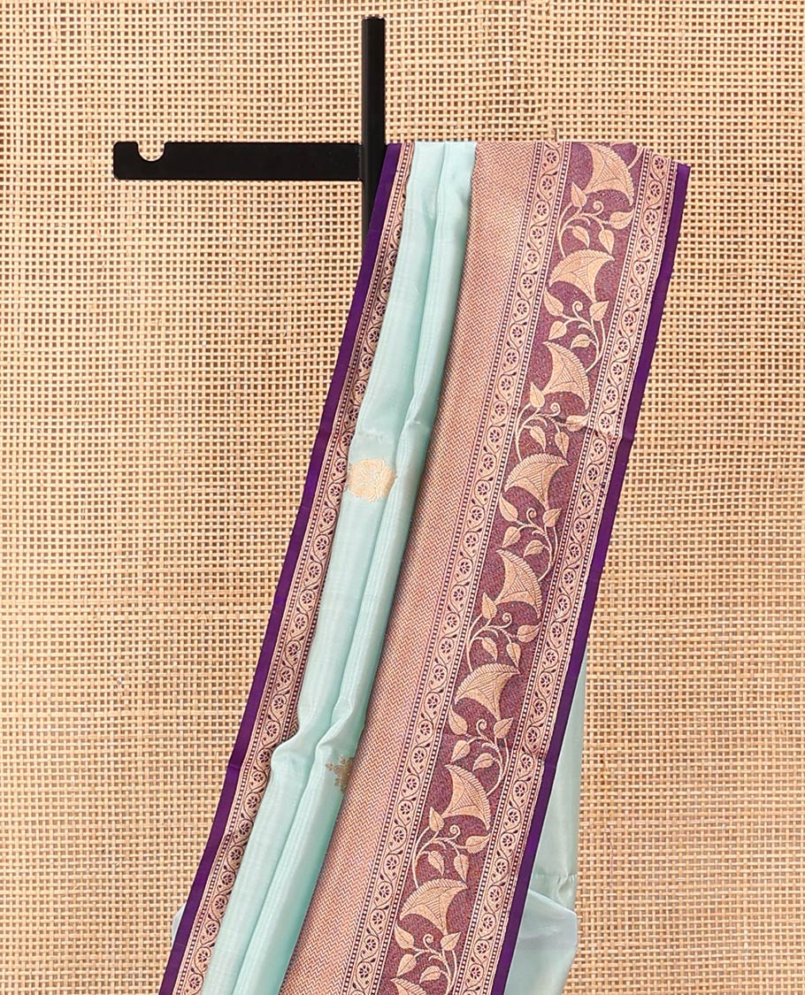 Baby Blue Raw Mango Silk Saree Subtly Sparked with Buttas, Complemented by a Contrast Traditional Zari-Designed Border, Featuring a Zari-Elevated Jaal-Designed Pallu, Paired with a Contrast Blouse