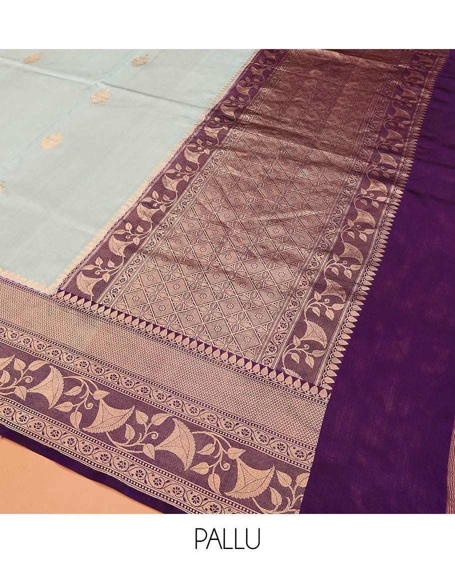 Baby Blue Raw Mango Silk Saree Subtly Sparked with Buttas, Complemented by a Contrast Traditional Zari-Designed Border, Featuring a Zari-Elevated Jaal-Designed Pallu, Paired with a Contrast Blouse